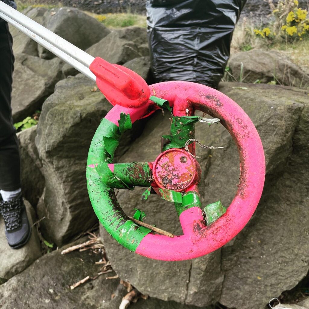 Pink toy steering wheel found on East Bay Beach in North Queensferry.