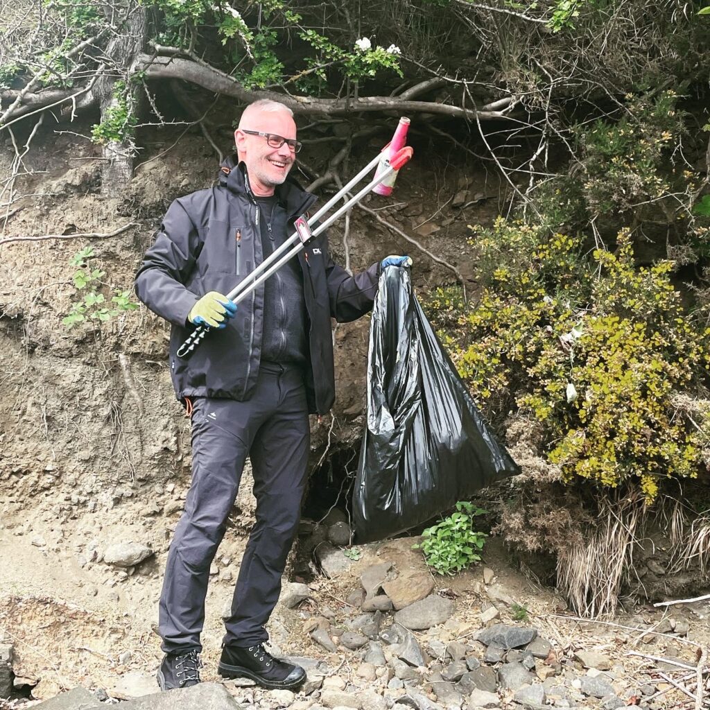 Our volunteer finding alcohol bottles in the bushes.