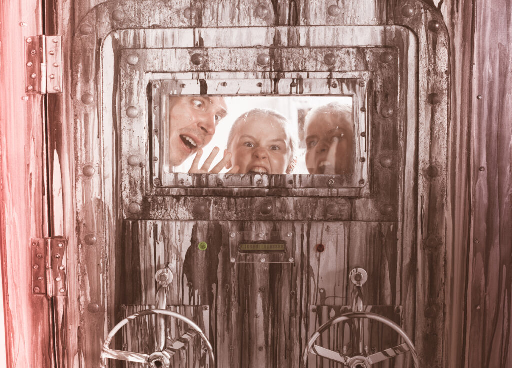Portrait of a mad family behind a closed door in quest room.